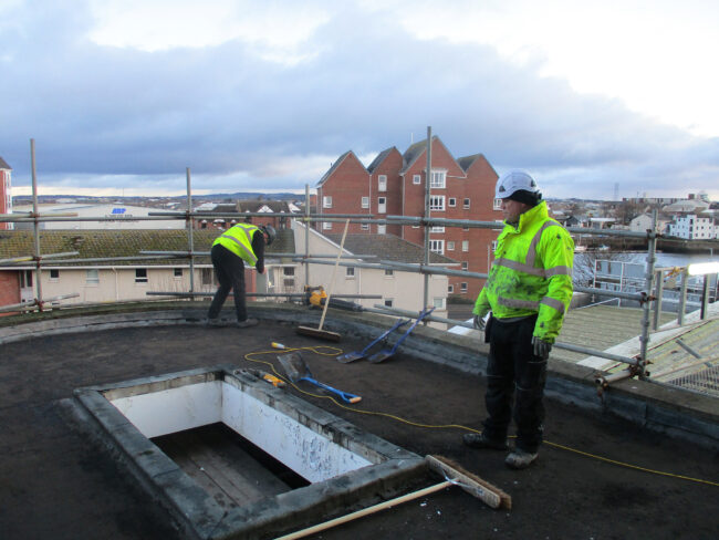 Citadel roofing works, men in hi-viz jackets carrying out maintenance works